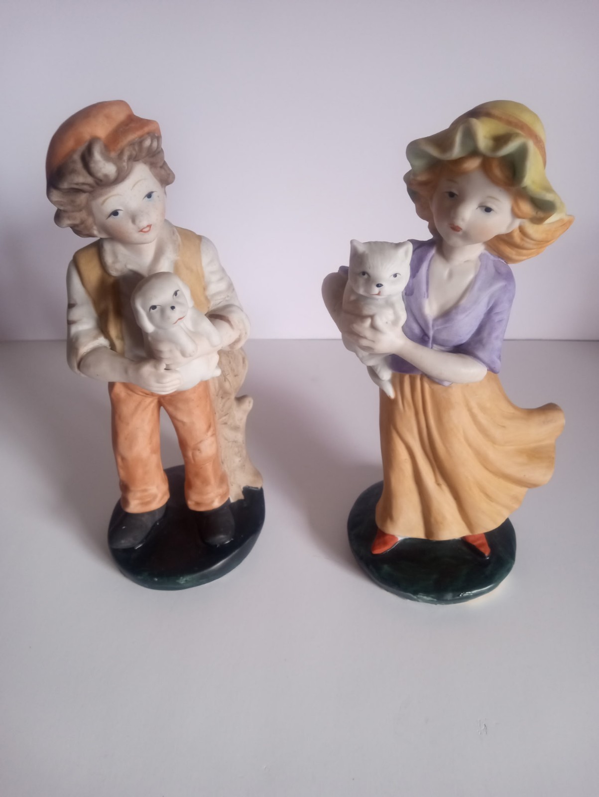 Ceramic Hand Painted Boy with dog  and Girl with Cat Figurines Multicolor Pair