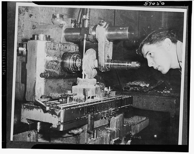 Photo:Man inspecting Kent machine tool industrial milling close-up 1950s