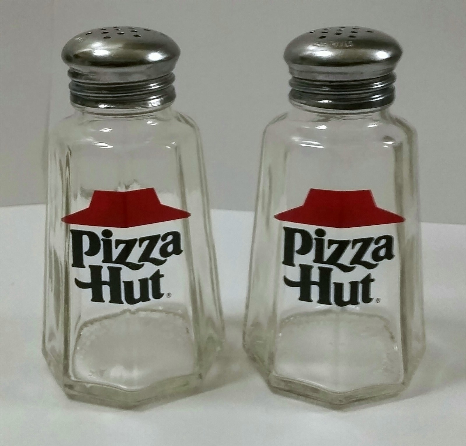 A Set of Pizza Hut Salt & Pepper Shakers