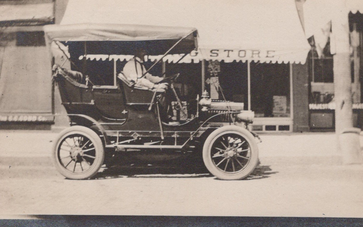 Will in His Brass Era Touring Car Drug Store Street 1909 - RPPC Photo Postcard