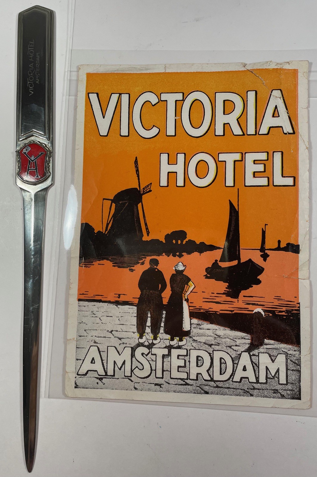 ANTIQUE VICTORIA HOTEL AMSTERDAM METAL LETTER OPENER W/ENAMEL LOGO HOLLAND