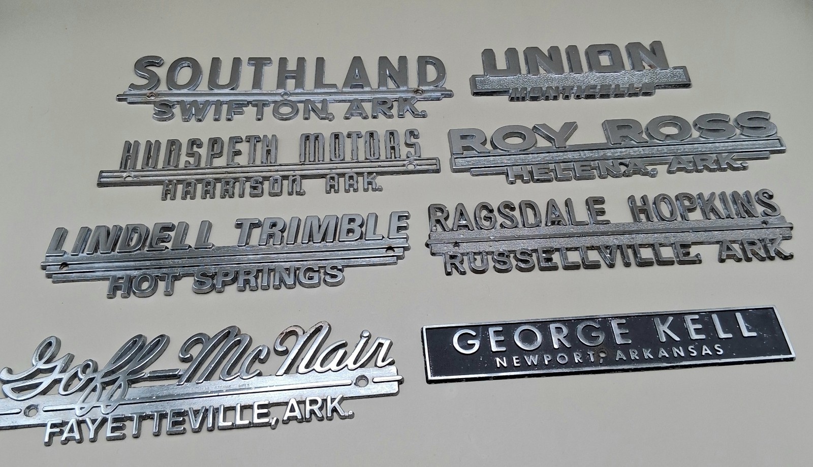 Lot of 8 Arkansas VINTAGE CAR/TRUCK Metal Dealership Emblems Automotive