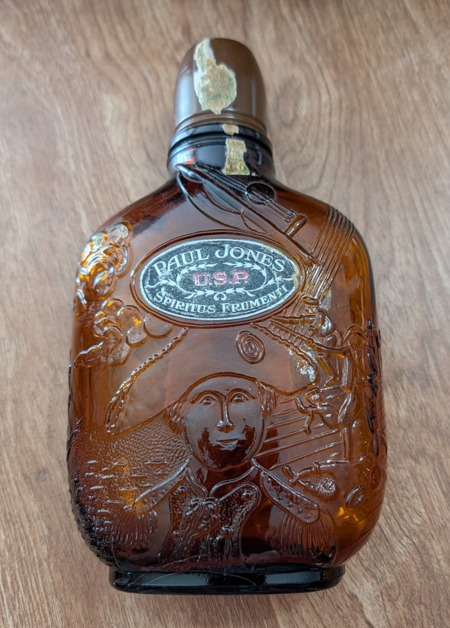 Spiritus Frumenti Paul Jones U.S.P.  Embossed Whiskey Flask Empty Spring 1913