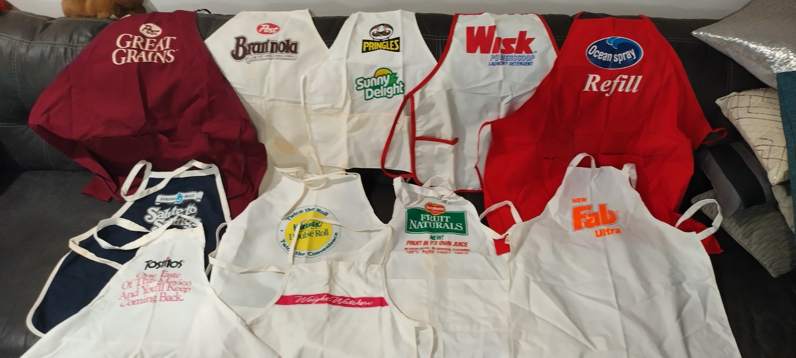 VINTAGE LOT OF 11 ADVERTISING APRONS, POST, FAB,WISK PRINGLES, SUNNY DELIGHT + VINTAGE LOT OF 11 ADVERTISING APRONS, POST, FAB,WISK PRINGLES, SUNNY DELIGHT +