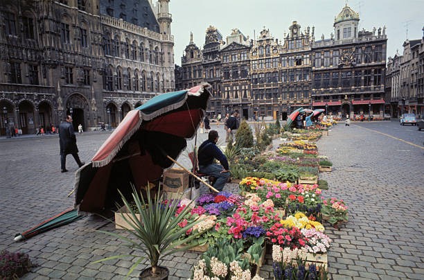 Brussels Belgium Flower sellers with their traditional red green u- Old Photo
