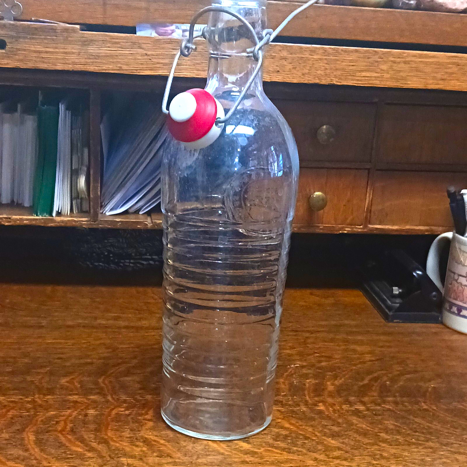 Clear Glass Swing-Top Bottle 1L Wire Bail Red Stopper Embossed \