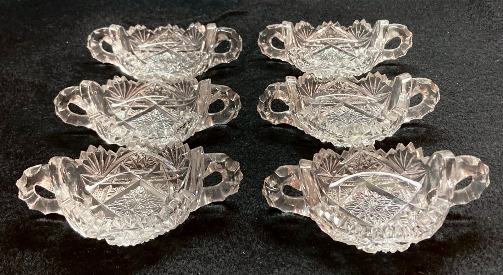 6 ABP cut glass salt dishes with faceted loop handles, c.1900, all-over cutting 6 ABP cut glass salt dishes with faceted loop handles, c.1900, all-over cutting