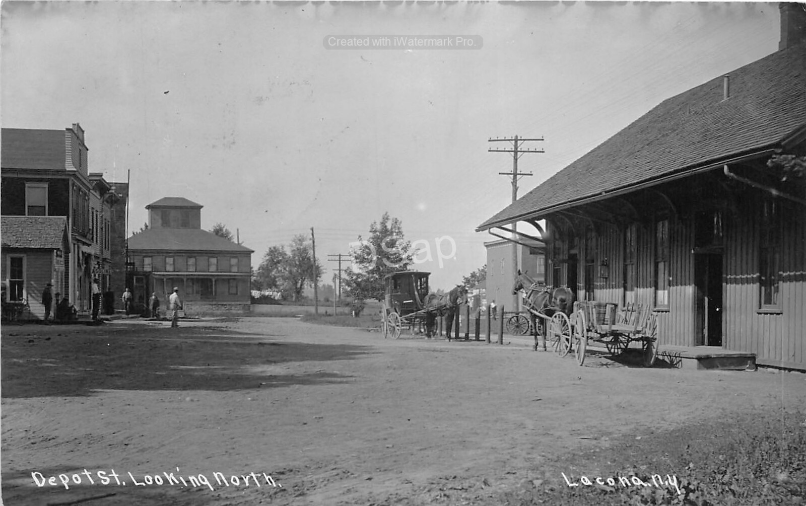 J48/ Lacona New York RPPC Postcard c1910 Buggy Railroad Depot Street 1