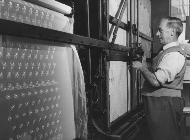 Worker adjusting the pantograph in an embroidery factory Historic Old Photo