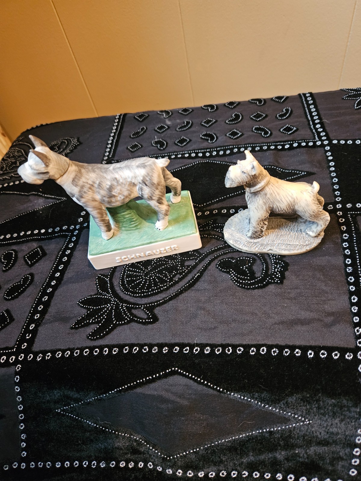 Two limited edition schnauzer figurines-one marble and one ceramic flask