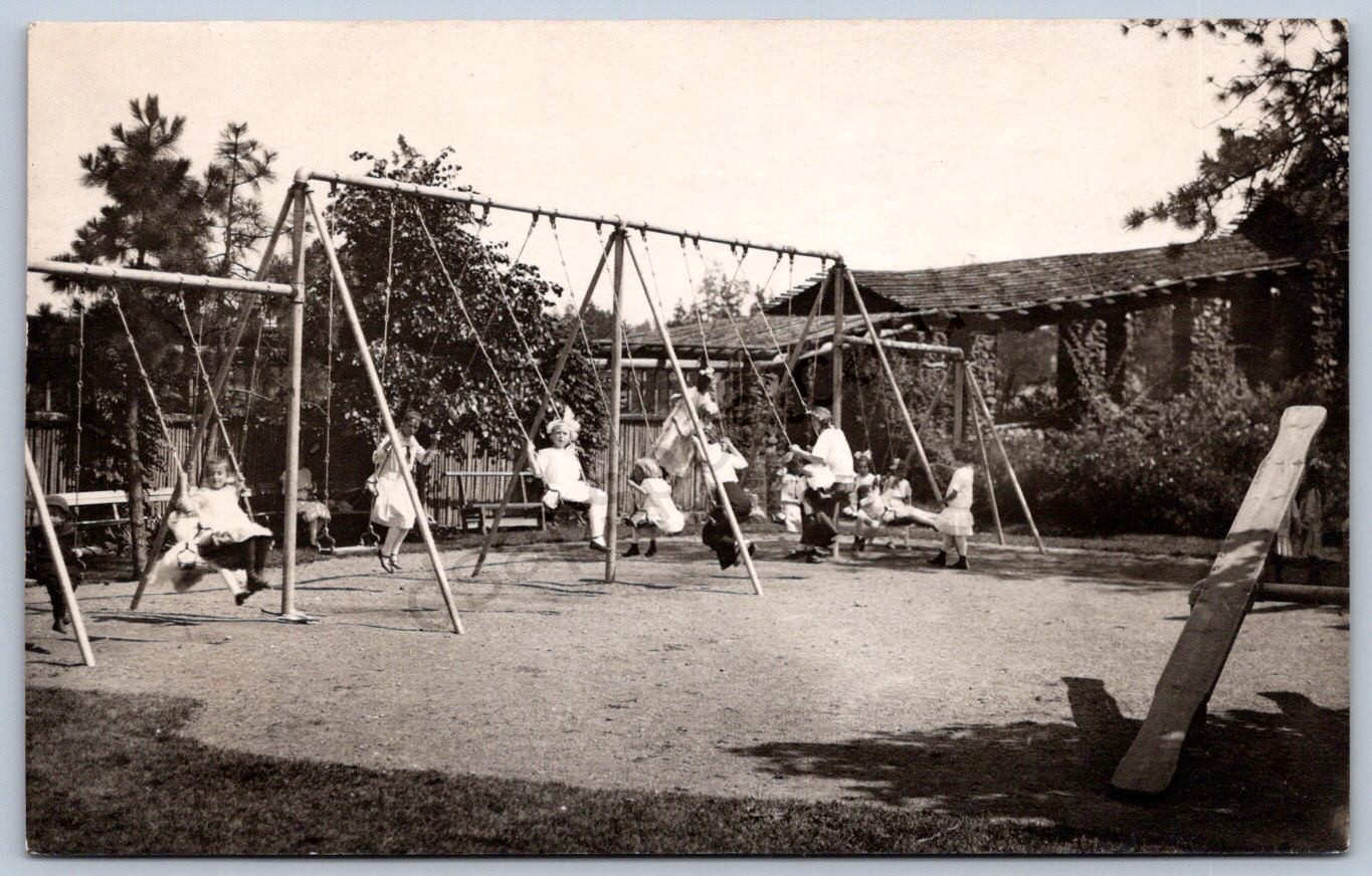 K40/ Interesting RPPC Postcard c1910 Americana Swing Set Kids Playground 525