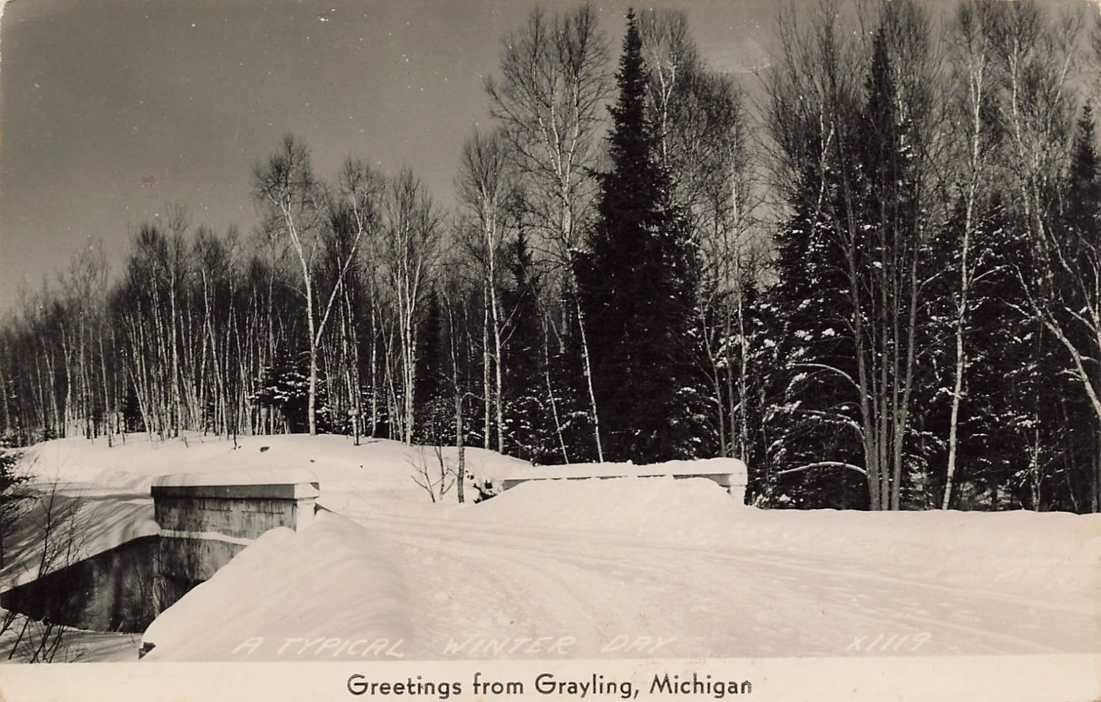 WINTER ROAD SCENE WITH BRIDGE REAL PHOTO POSTCARD GRAYLING MICHIGAN 1940s RPPC