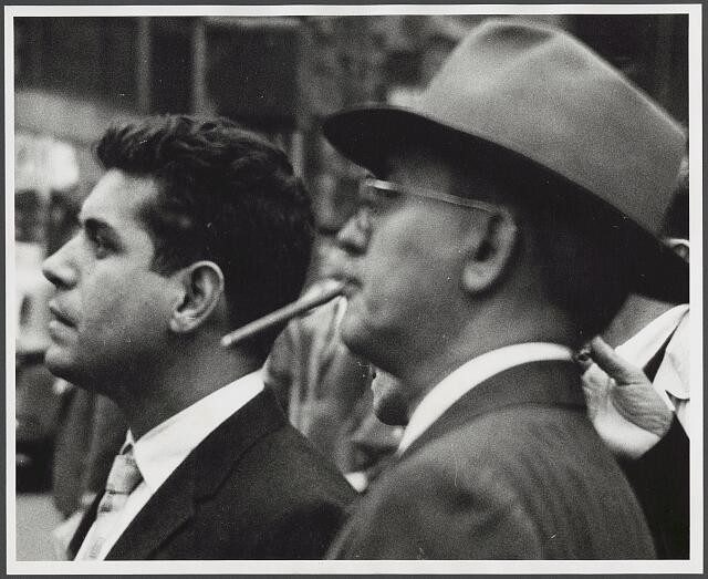 Photo:Two Men Smoking Cigars 1950s Crowd Portrait Black and White