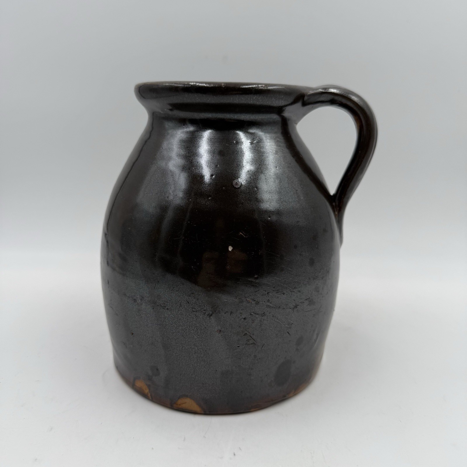 7” Chocolate Brown Stoneware Jug With Handle, Glossy Glaze, Unmarked 7” Chocolate Brown Stoneware Jug With Handle, Glossy Glaze, Unmarked