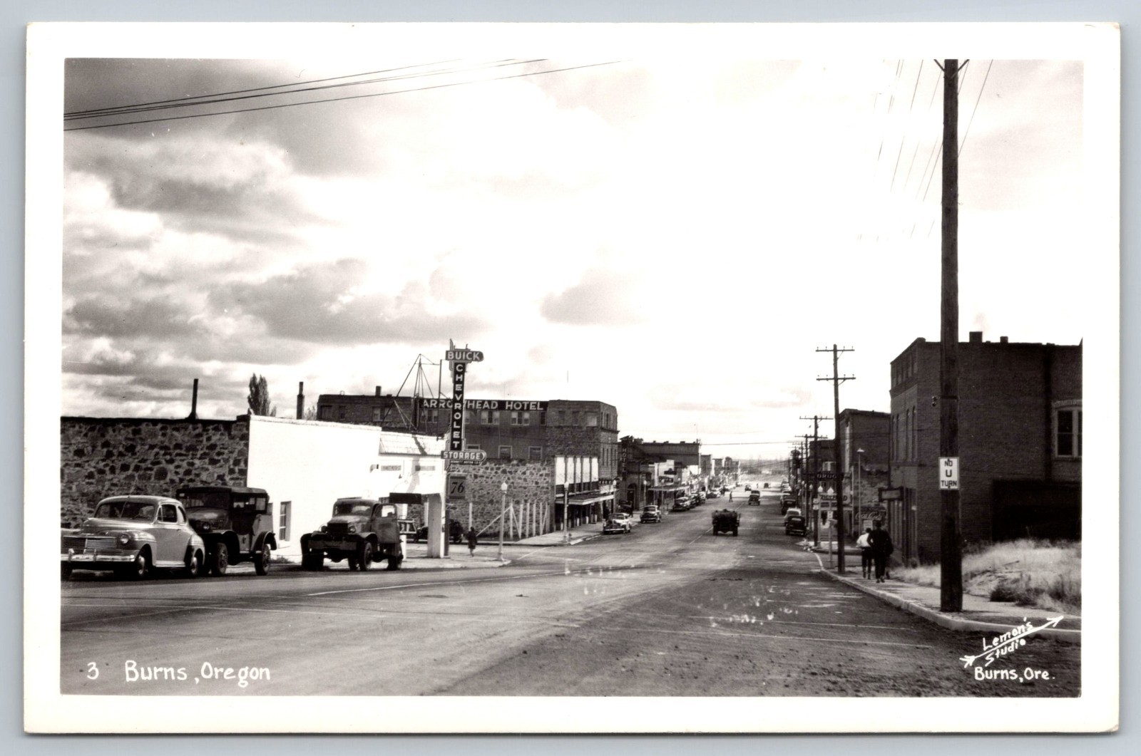 Burns Oregon RPPC Downtown Street View Buick Chevy Hotel Photo Postcard OR