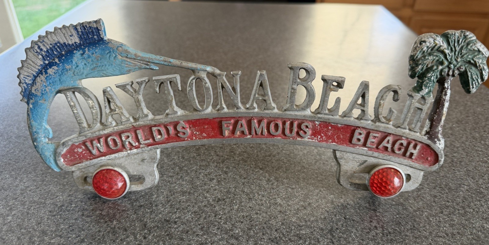 Vtg Daytona Beach License Plate Topper With Red Reflectors