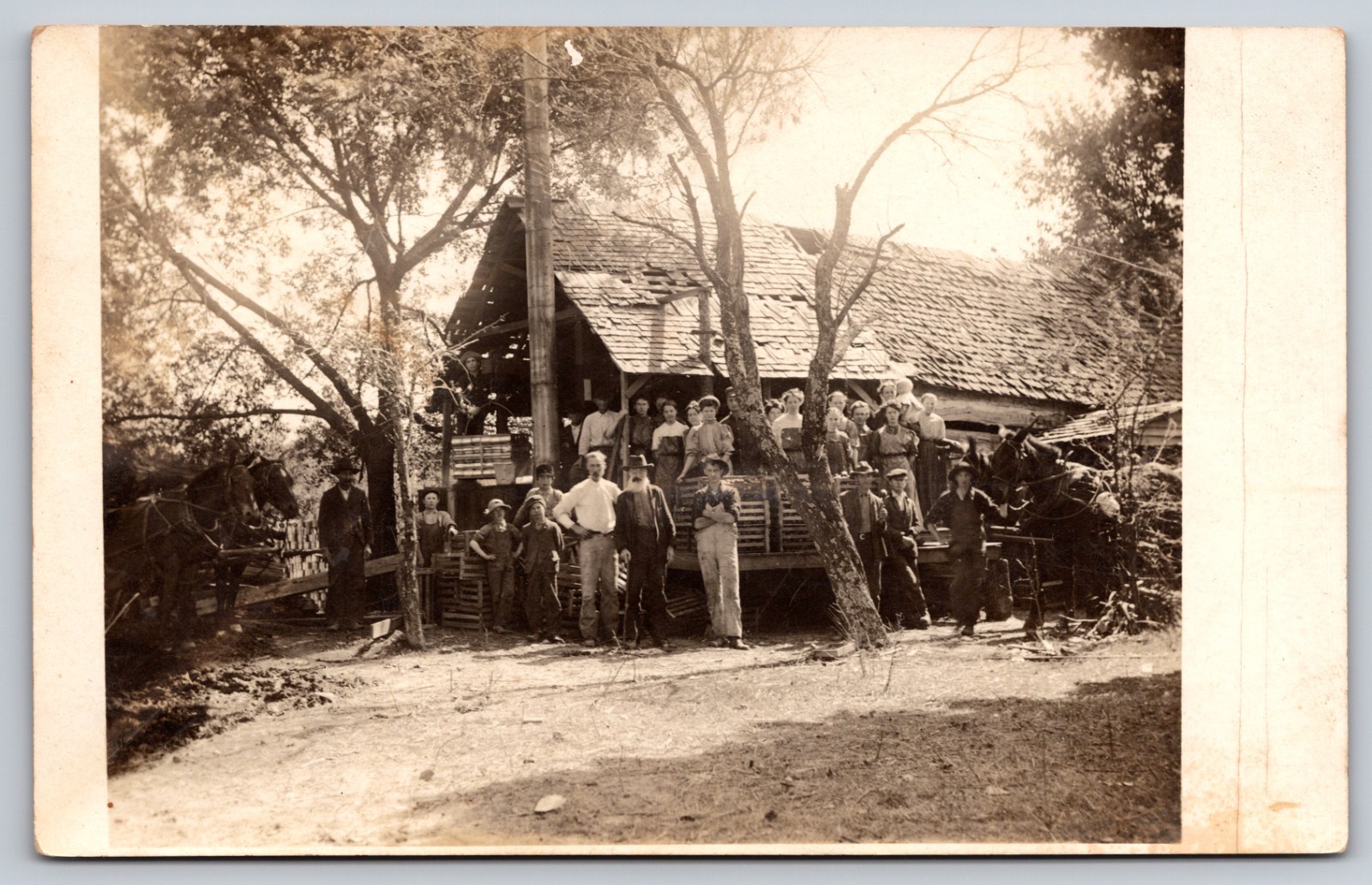 Group of Mill/Factory Employees Men Women & Children by Rustic Building (RPPC)