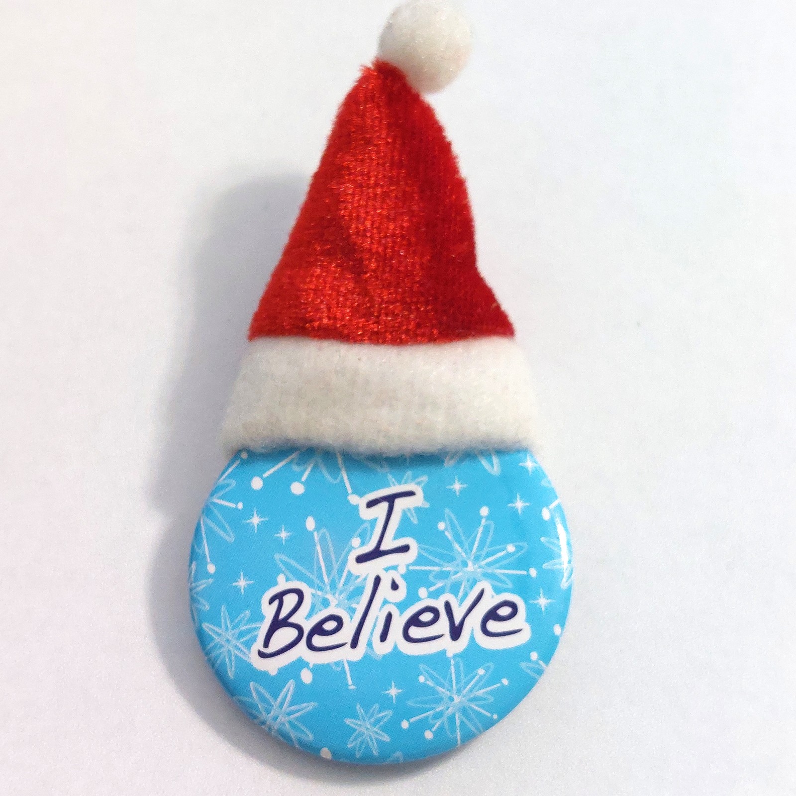 I Believe Christmas Pinback Button Pin Plush Santa Hat Blue Snowflakes Holiday I Believe Christmas Pinback Button Pin Plush Santa Hat Blue Snowflakes Holiday