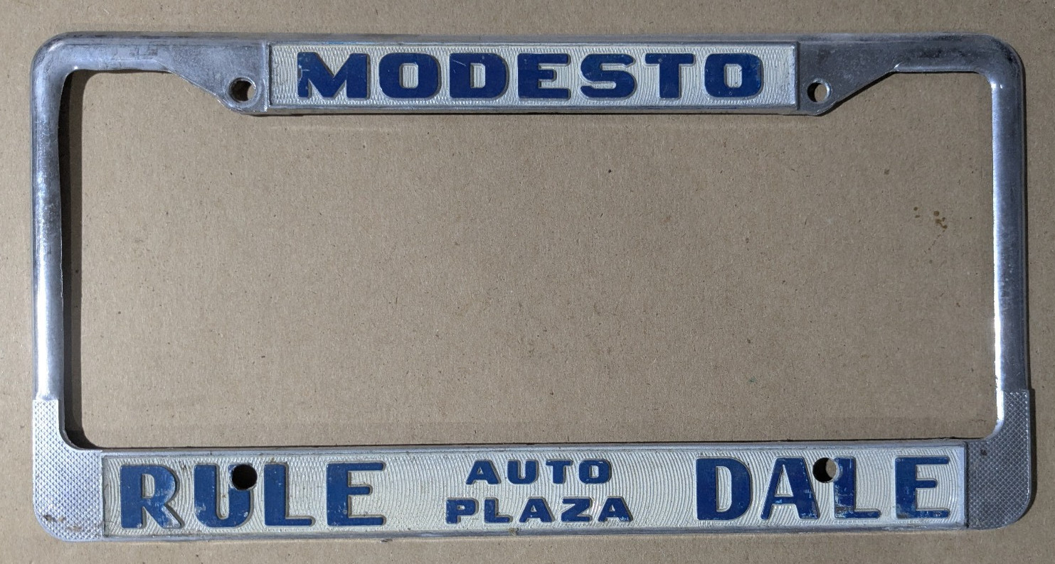 VTG Metal Modesto California Rule Dale Auto Plaza Embossed License Plate Frame