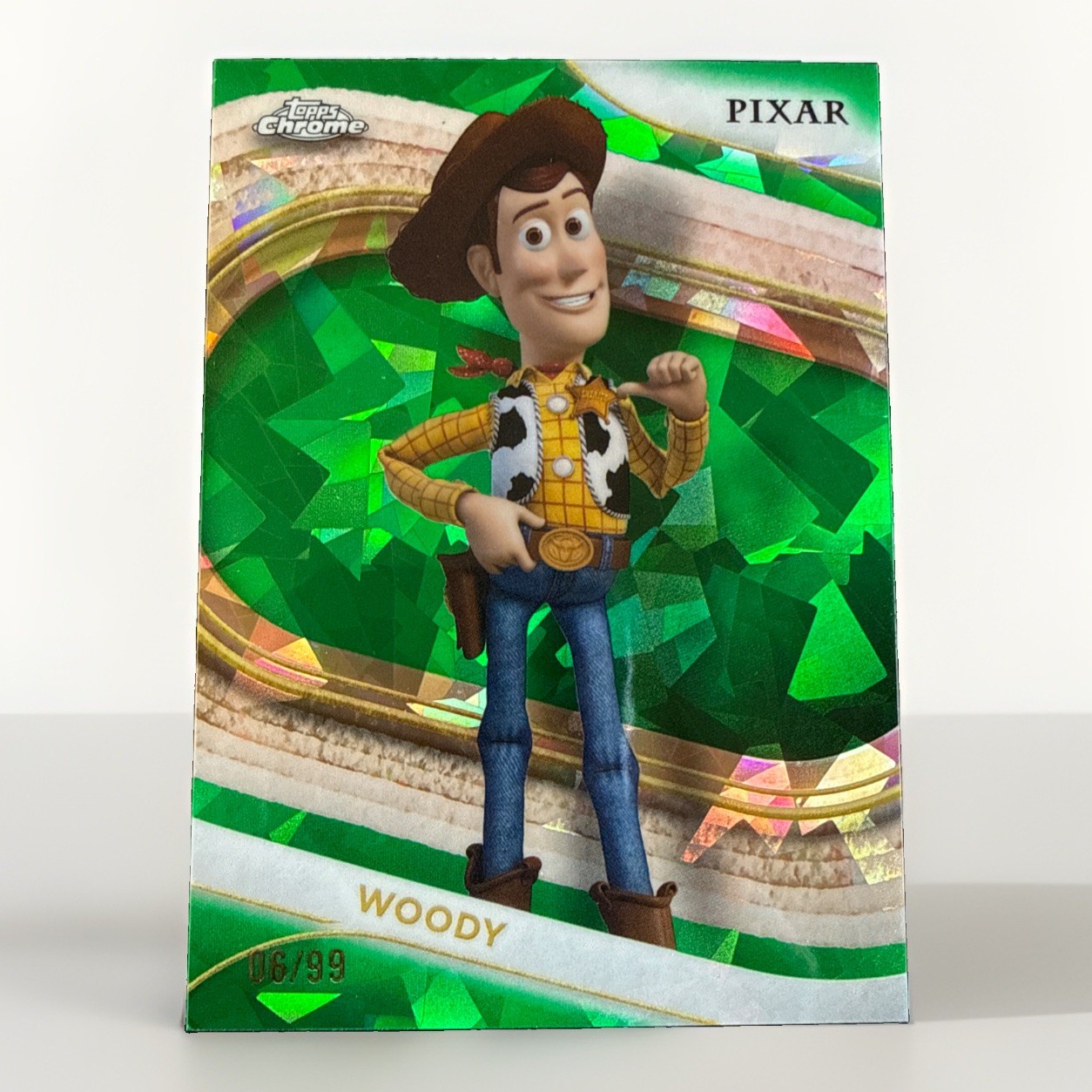 2025 Topps Chrome Sapphire Disney Woody Green /99 Toy Story