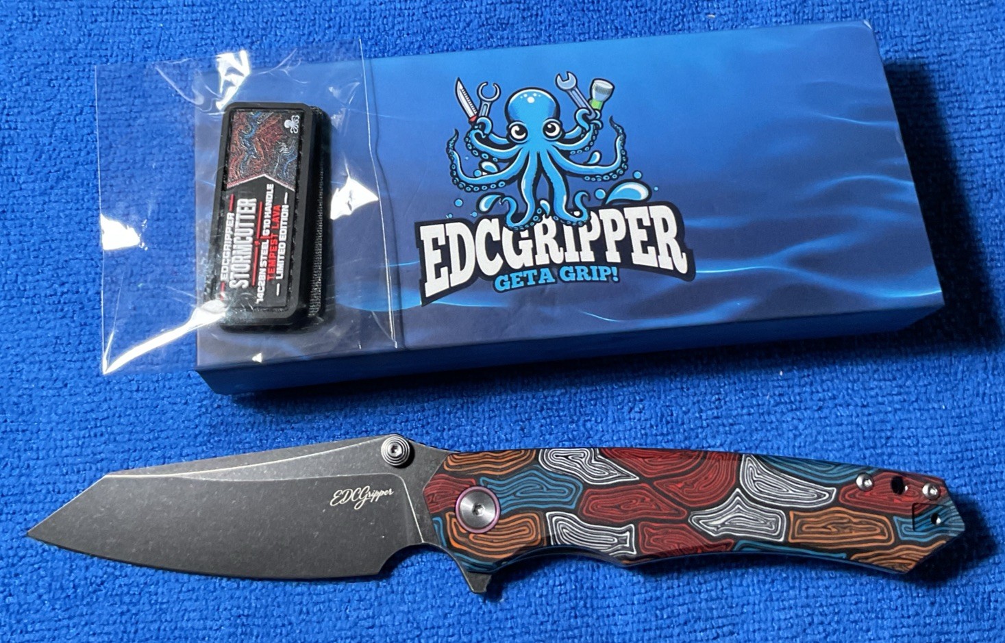 EDCGRIPPER Storm Cutter Tempest Lava. # 137 of 200 Back Flip Thumb Stud w Patch 