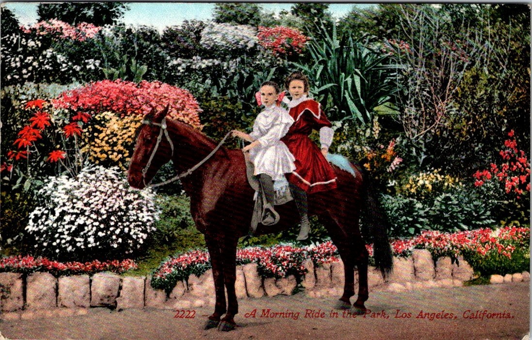 Antque PC of two little girls on morning Horse ride in a park in Los Angeles Cal