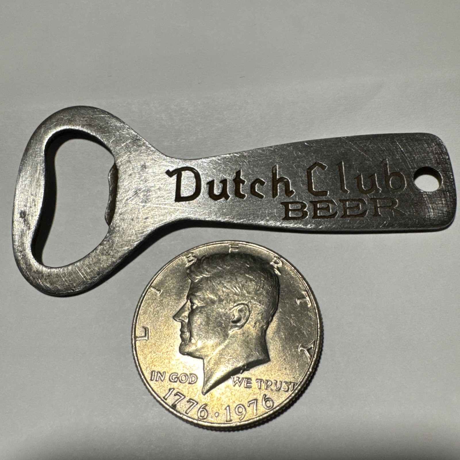 DUTCH CLUB BEER VINTAGE BOTTLE OPENER & 1976 Kennedy Half Dollar Coin