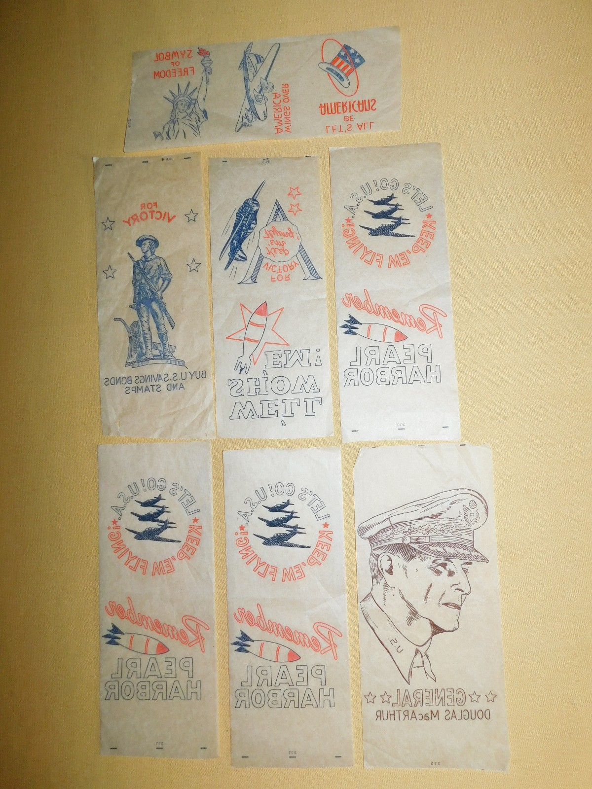 VINTAGE 7 WWII SOLDIER DECALS PEARL HARBOR AIRPLANES US BONDS GEN MACARTHUR VINTAGE 7 WWII SOLDIER DECALS PEARL HARBOR AIRPLANES US BONDS GEN MACARTHUR