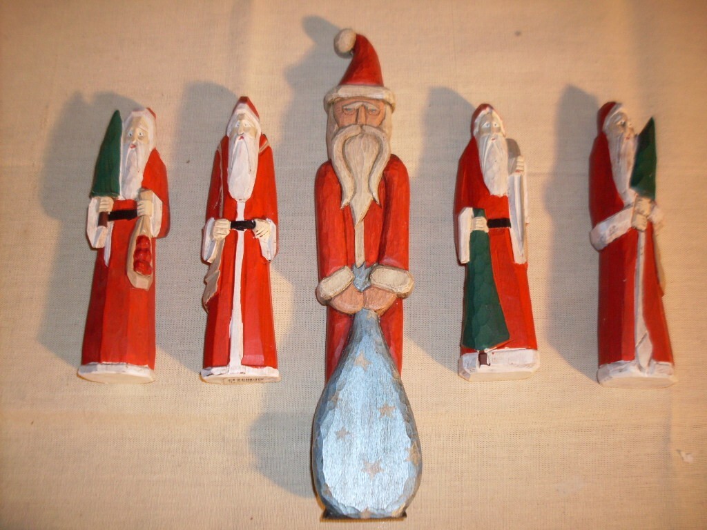 Folk Art Carved Santa Figures. Unique, hand-crafted, solid wood, varied poses.