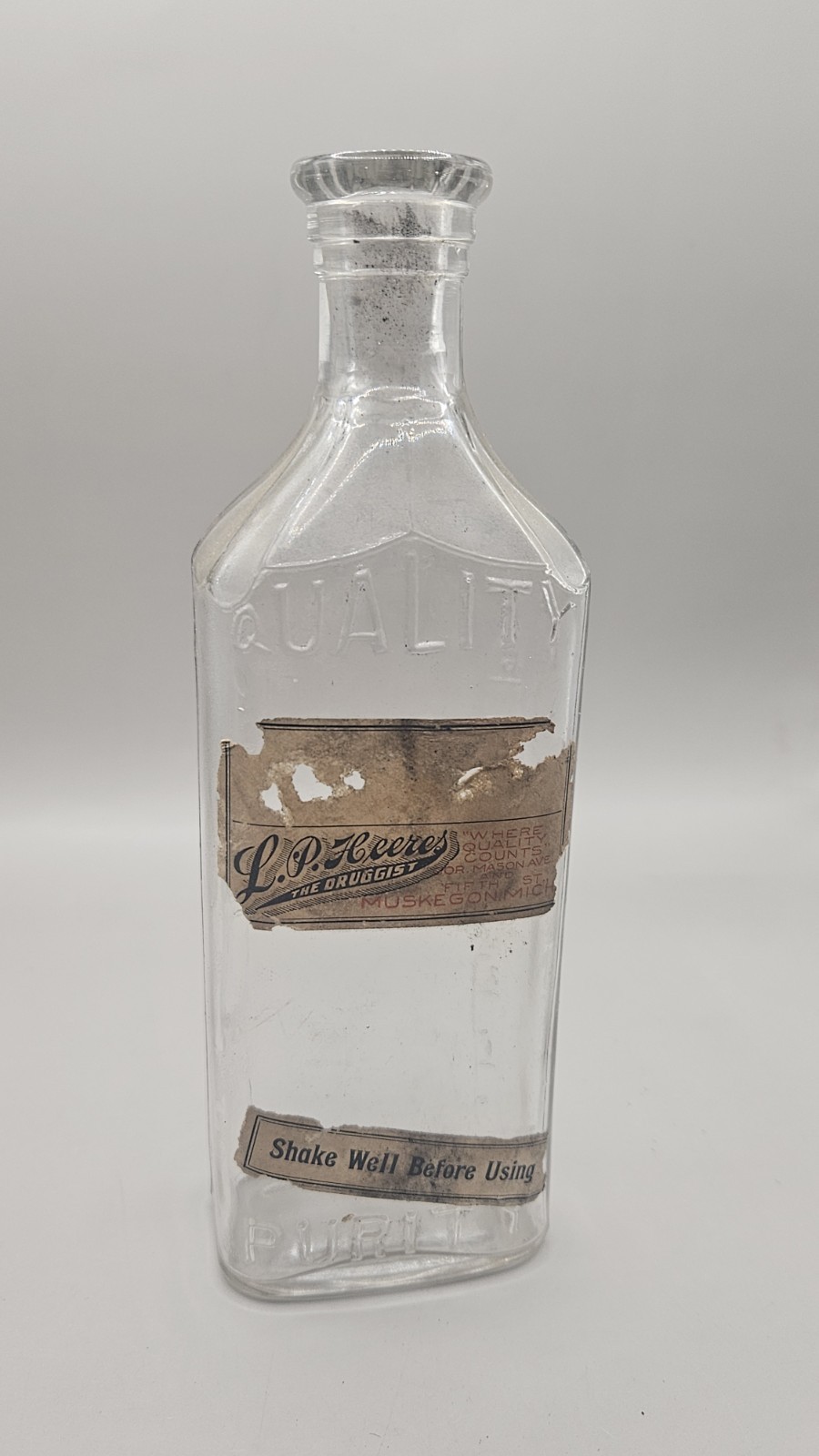 L. P. Heeres The Druggist Muskegon Michigan Antique Glass Bottle