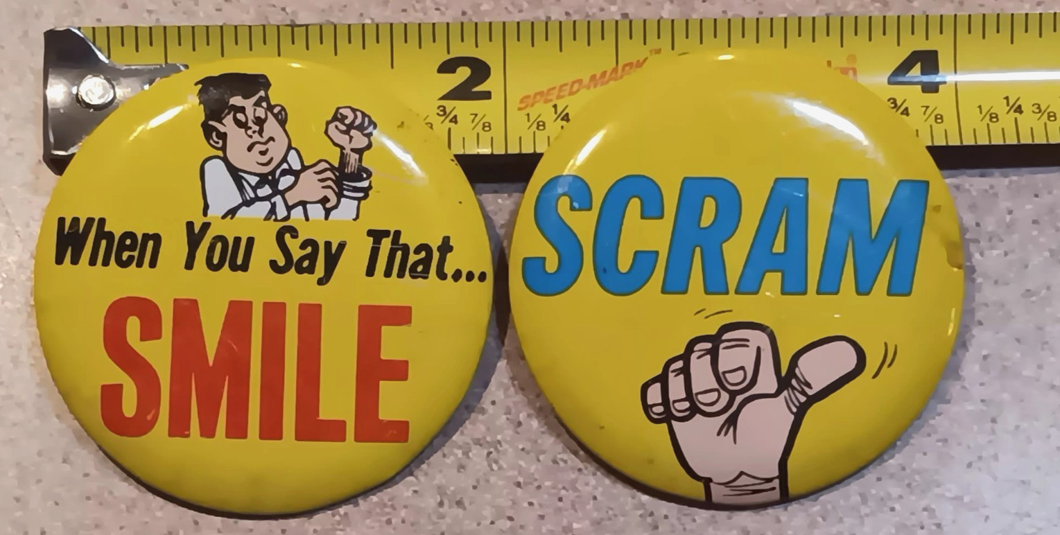 2 Vintage Japan Novelty Pins Buttons SCRAM When You Say That SMILE 2\