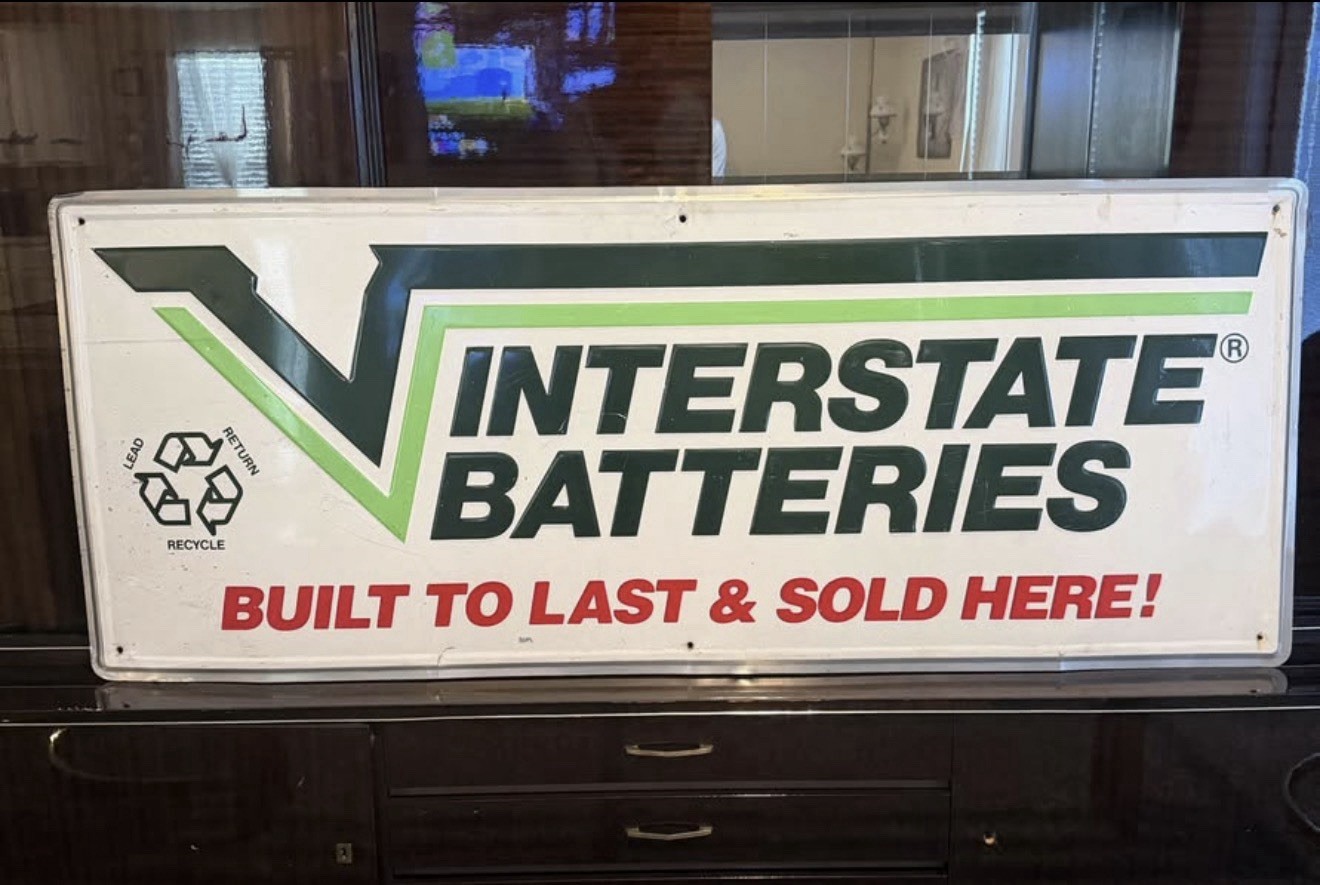 INTERSTATE BATTERIES Embossed Tin Metal Dealer Sign Used GUC 60x24” (5ft x 2ft)