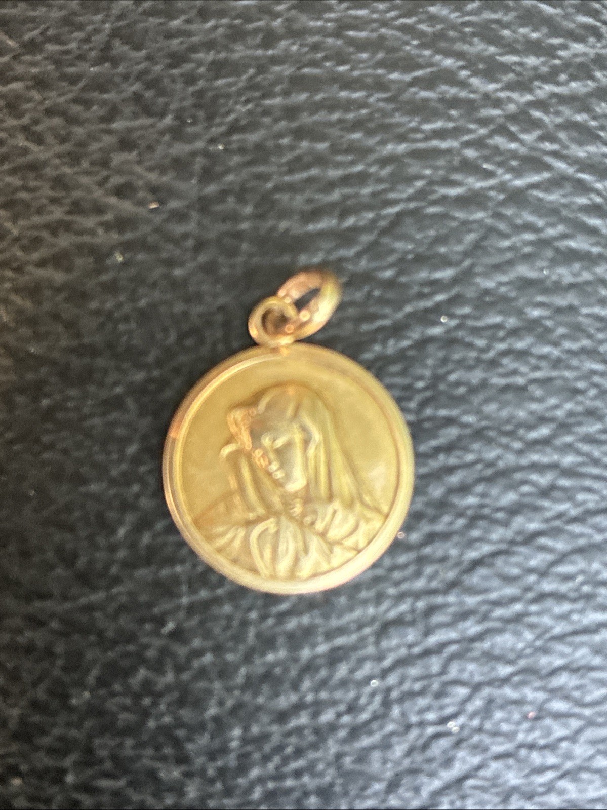 round yellow gold religious medal pendant depicting the Virgin Mary