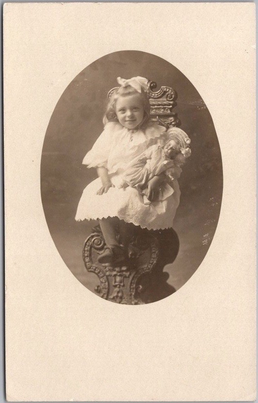 c1910s PLYMOUTH, Wisconsin Studio RPPC Postcard VERY Cute Little Girl with Doll
