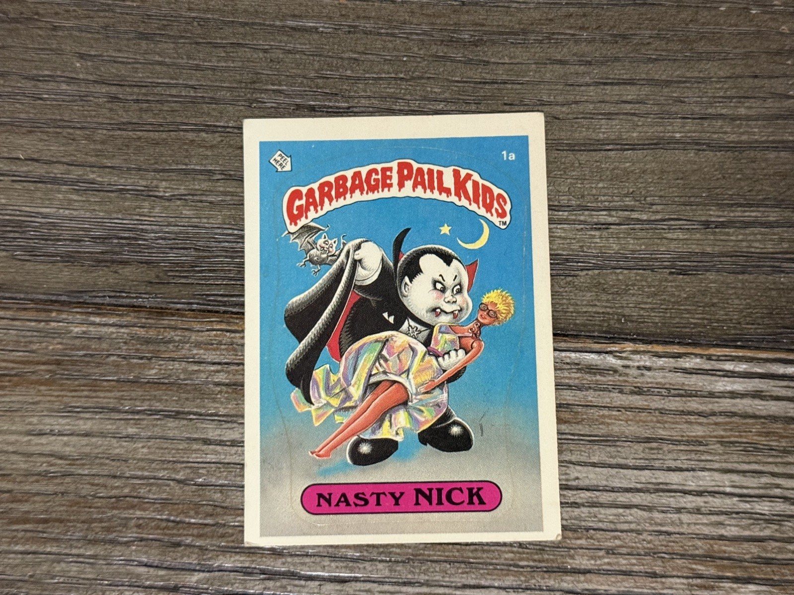 Topps 1985 Garbage Pail Kids Series 1 Sticker Card #1a Nasty Nick Topps 1985 Garbage Pail Kids Series 1 Sticker Card #1a Nasty Nick