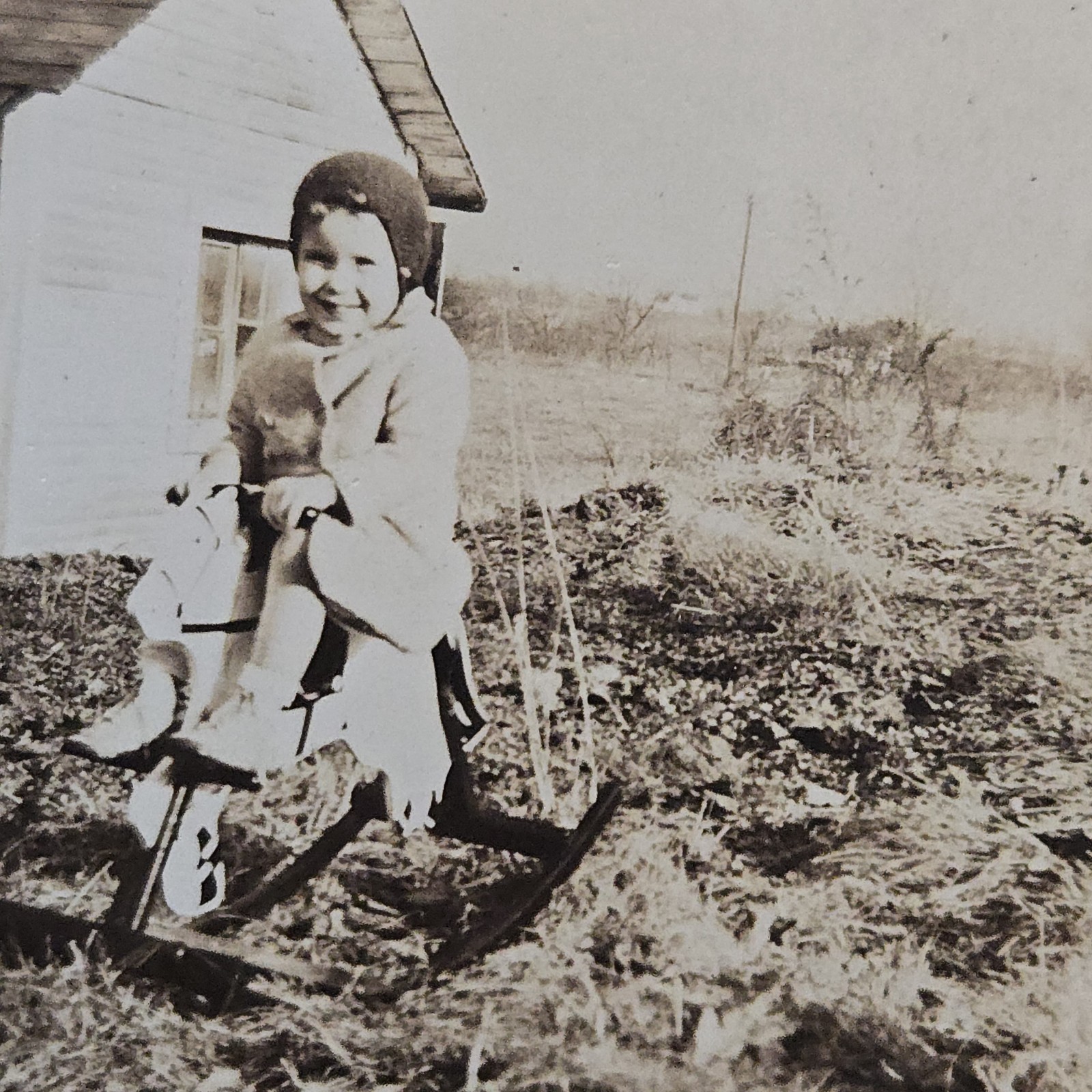 Vintage B&W Photo Snapshot of Young Child on Rocking Horse Outside in Lawn Vintage B&W Photo Snapshot of Young Child on Rocking Horse Outside in Lawn