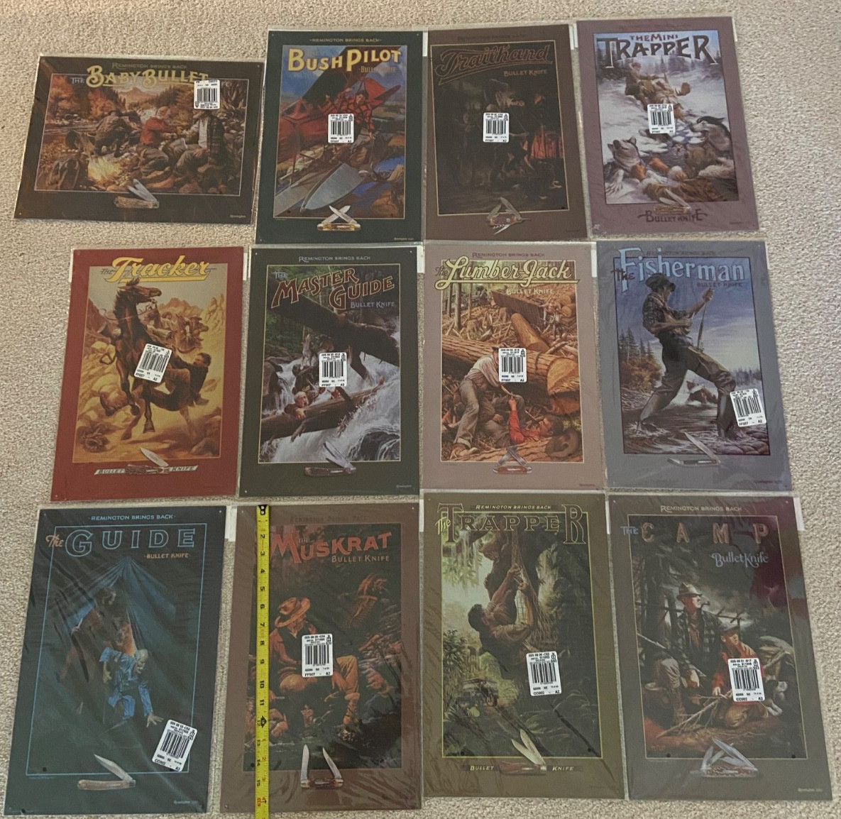 lot 12 different Remington Brings Back bullet knife tin signs new in bag lot 12 different Remington Brings Back bullet knife tin signs new in bag