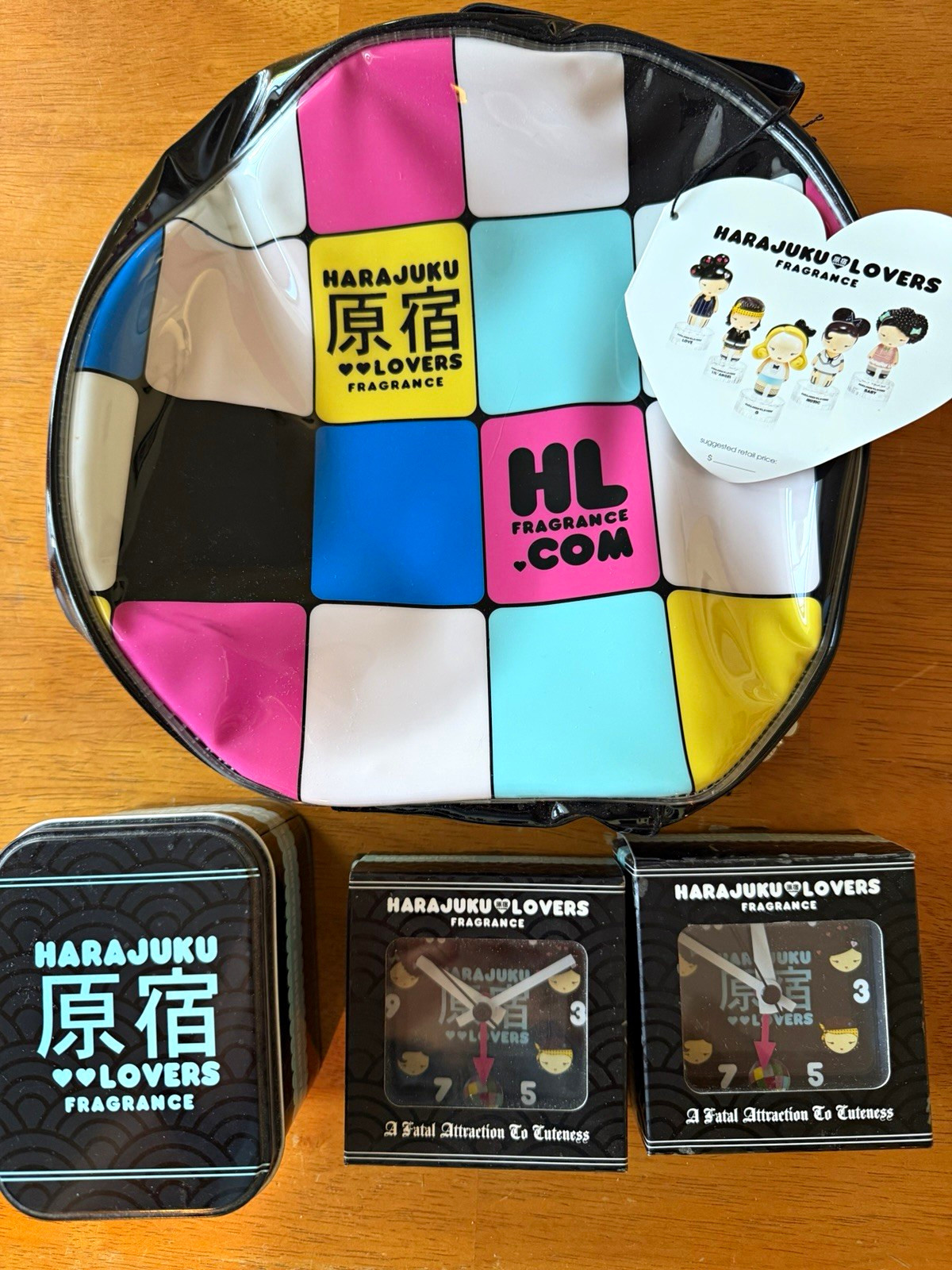 Harajuku Lovers travel bag with 2 unused clocks, one unused watch, untested Harajuku Lovers travel bag with 2 unused clocks, one unused watch, untested