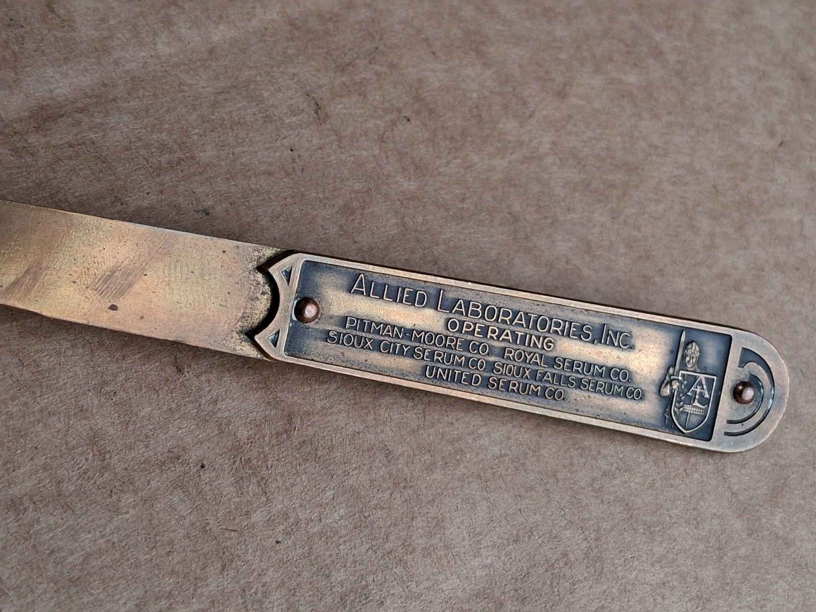 Vintage Allied Laboratories Inc Royal Serum Co Bronze Letter Opener Advertising