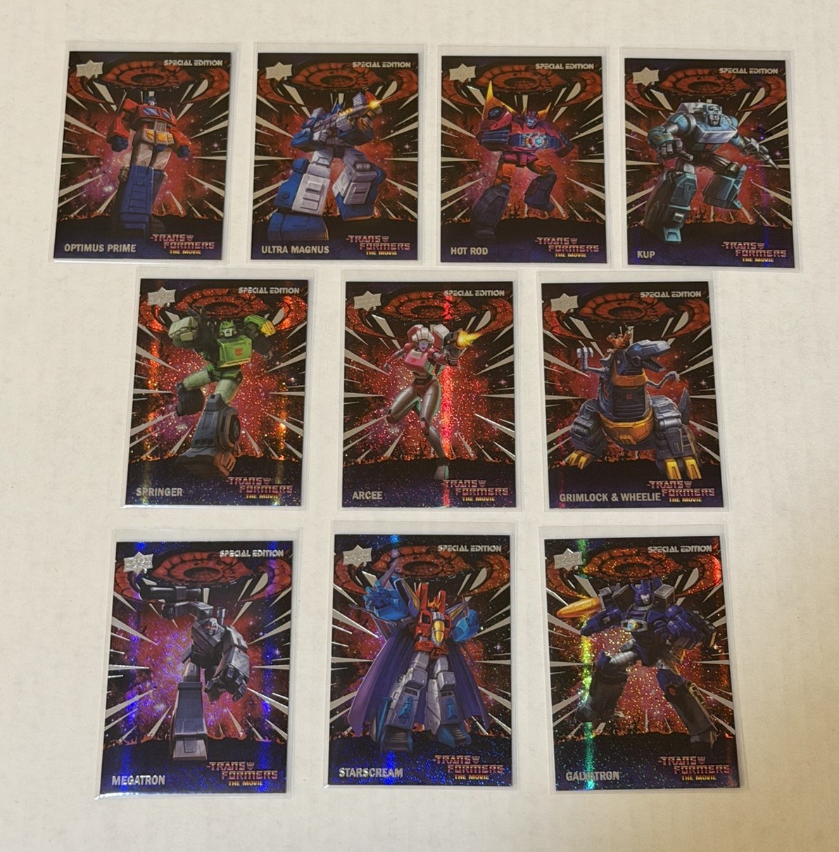 2026 Upper Deck Transformers: The Movie 40th “Galaxy” Parallel 10-Card Lot RARE 2026 Upper Deck Transformers: The Movie 40th “Galaxy” Parallel 10-Card Lot RARE