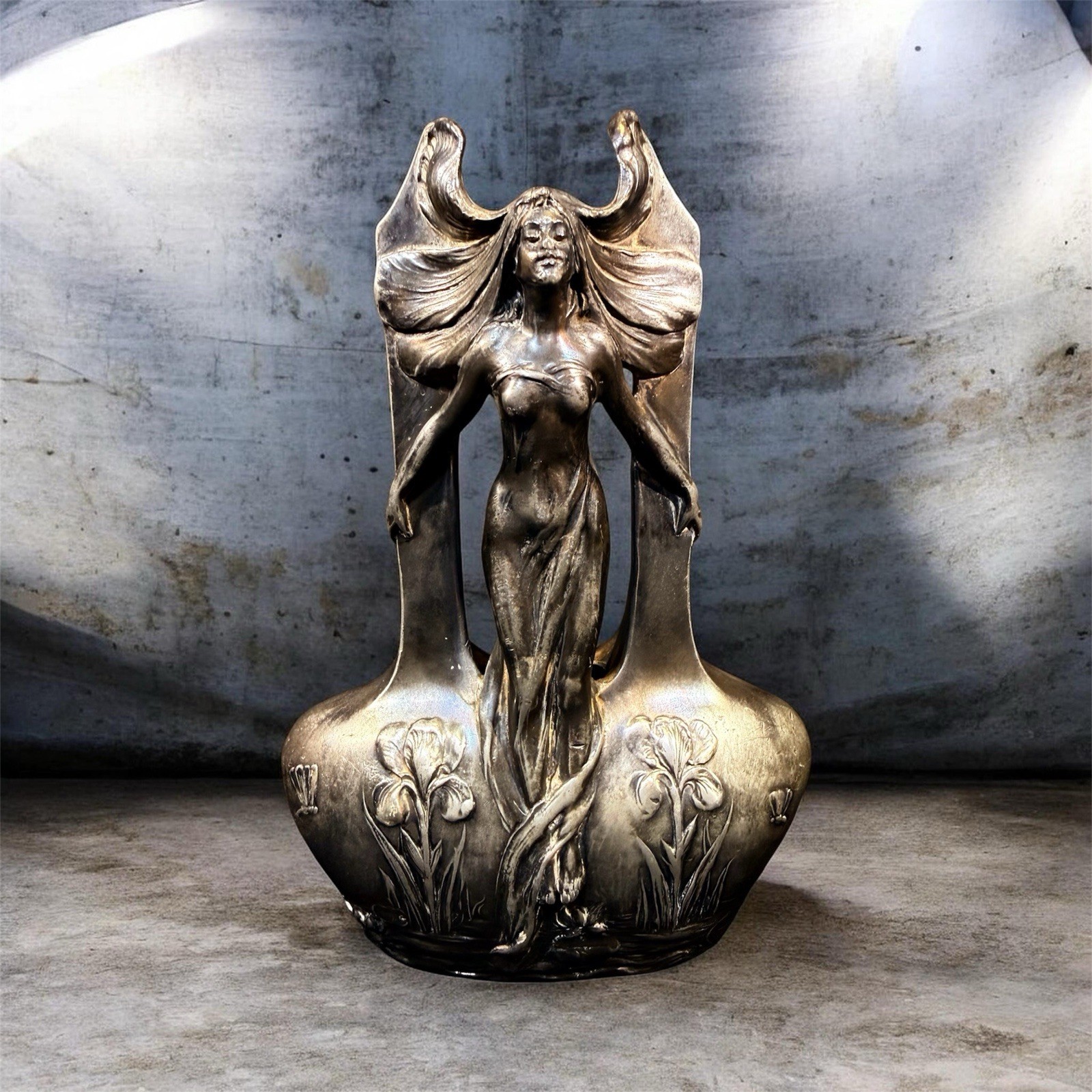 Art Nouveau pewter or silvered metal vase depicting a winged female figure Art Nouveau pewter or silvered metal vase depicting a winged female figure