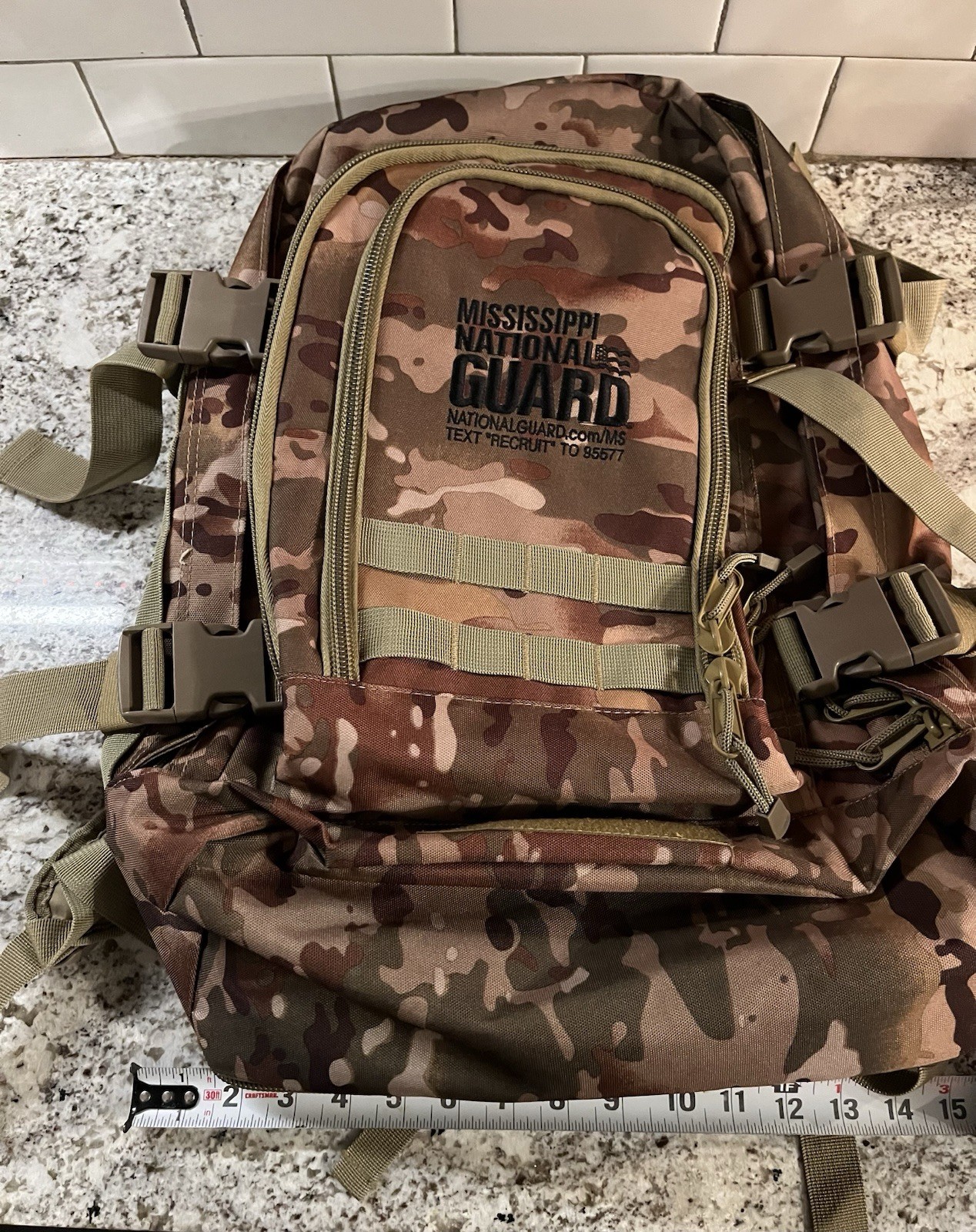 camouflage tactical backpack featuring the Mississippi National Guard logo