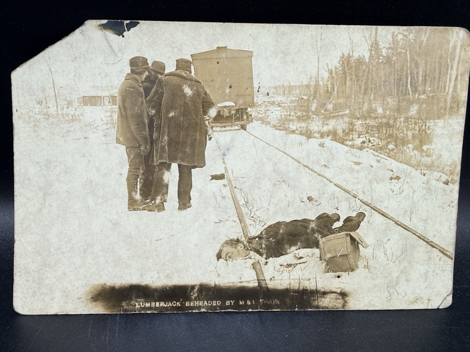 Lumberjack Beheaded by M&I Northern Pacific Railway Train RPPC Postcard GORE