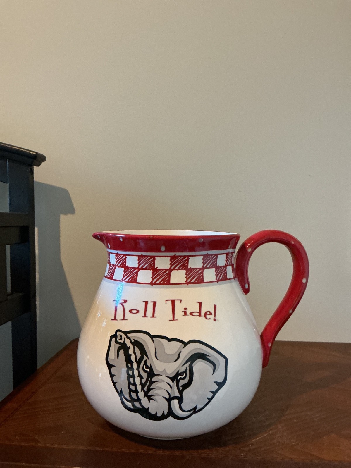 ceramic pitcher features a hand-painted Big Al elephant graphic 