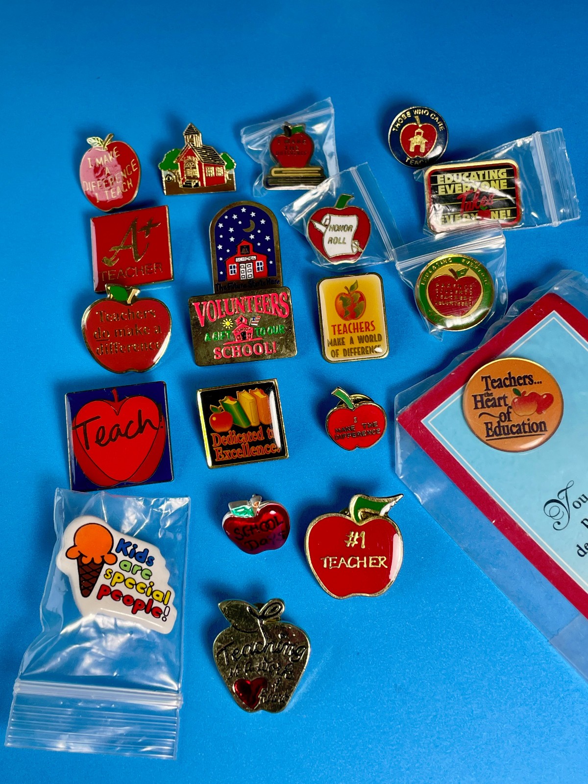 20 vintage teacher appreciation and school-themed lapel pins