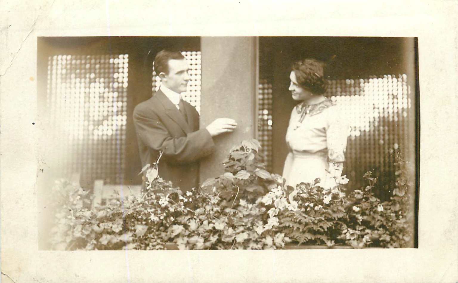 Vintage RPPC Couple Balcony Flirting Flowers Early 1900s Real Photo Postcard