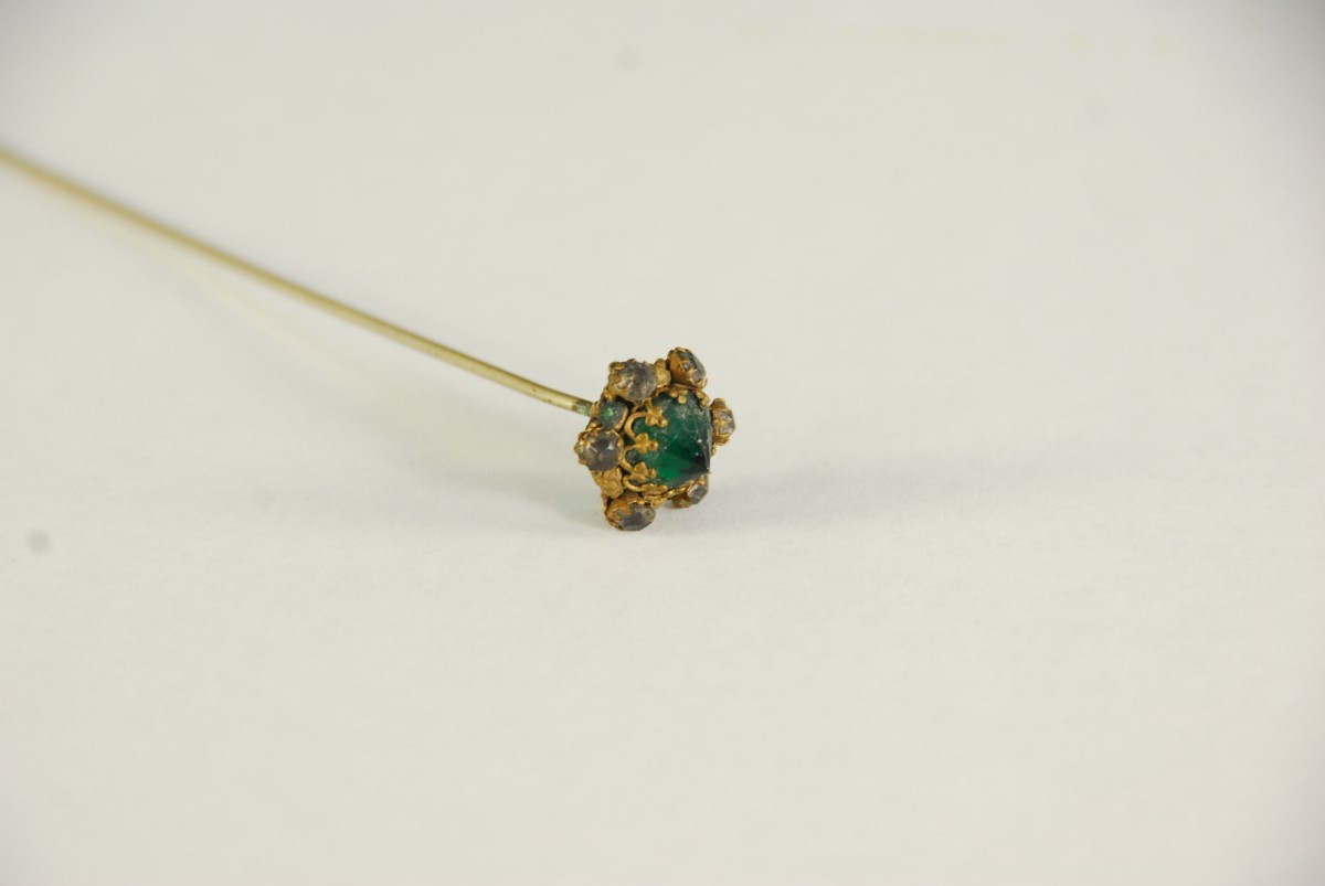 Vintage Antique Hatpin , gold tone Filigree, green faceted emerald-like stone.