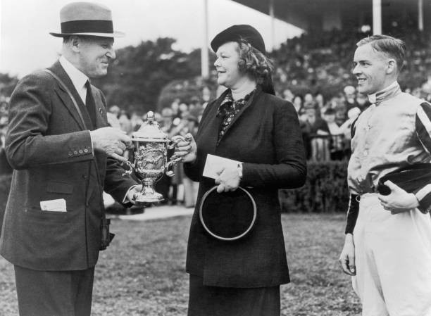 Joseph E Widener president of Belmont Park presents a trophy to Mr- Old Photo