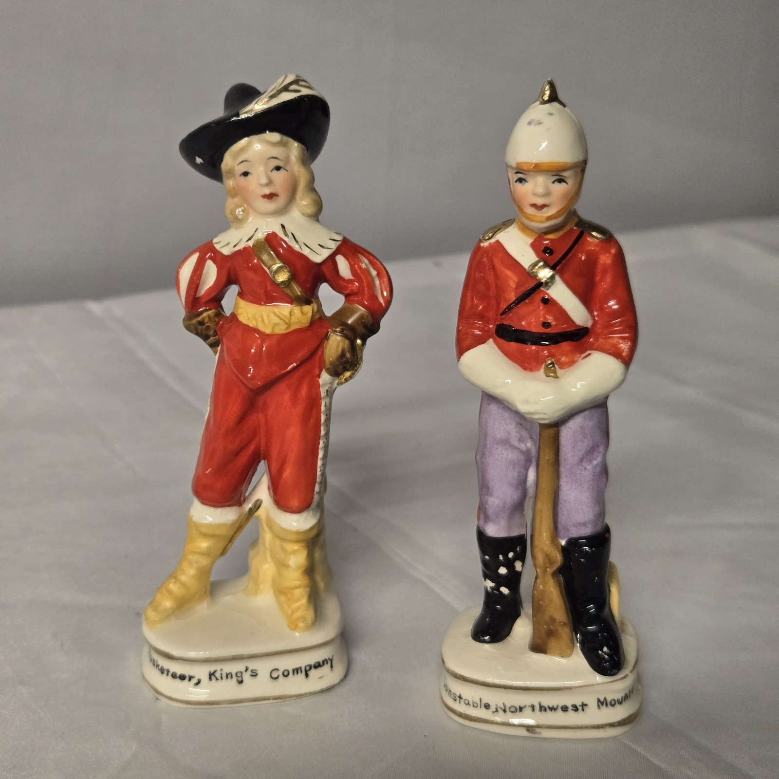 2 Vintage Enesco Japan Porc. Figures Musketeer King\'s Comp. & NWMP Canada E21