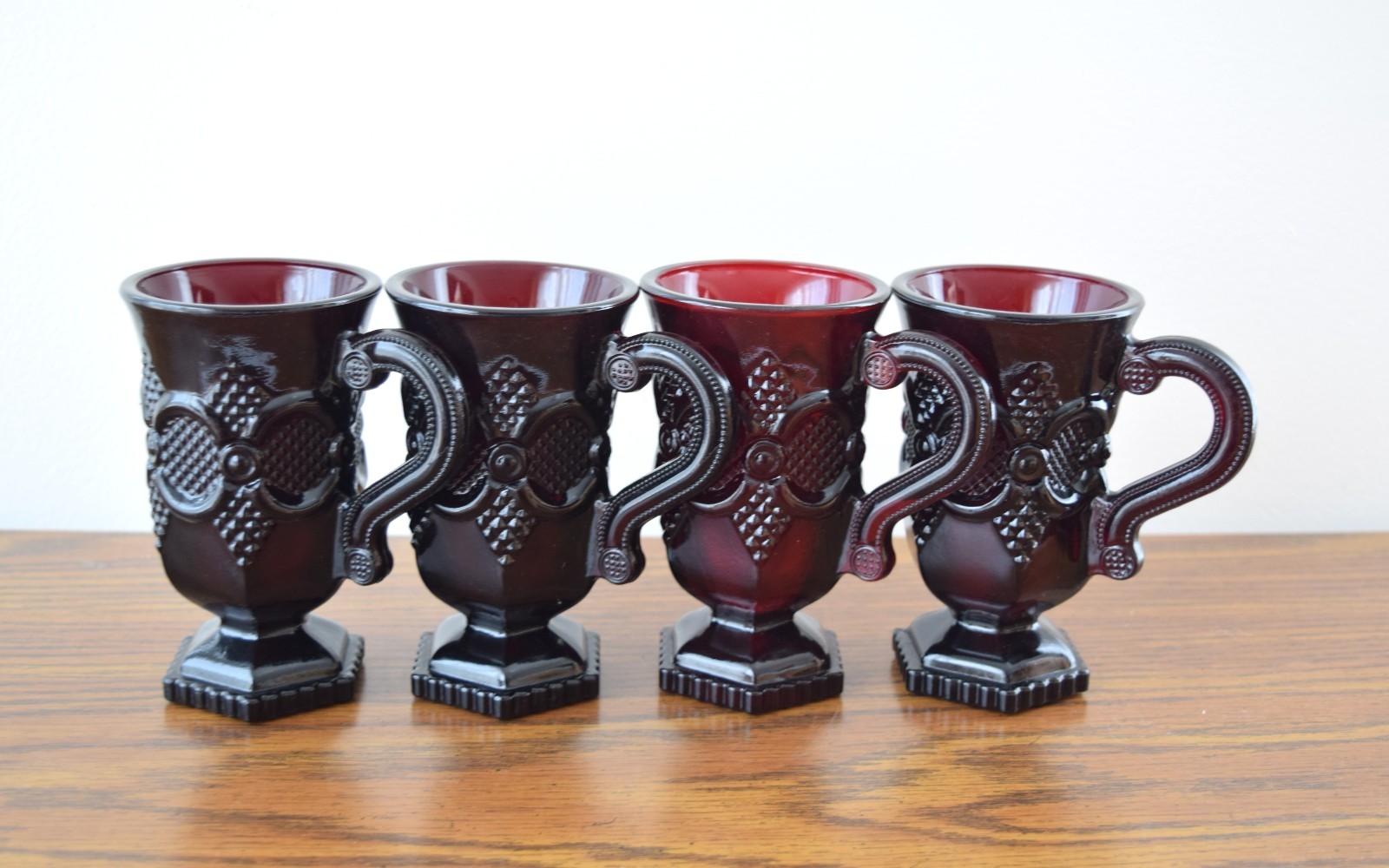 Set of 4 AVON 1876 Cape Cod Ruby Red Glass Footed Mugs Irish Coffee Cups Handle Set of 4 AVON 1876 Cape Cod Ruby Red Glass Footed Mugs Irish Coffee Cups Handle